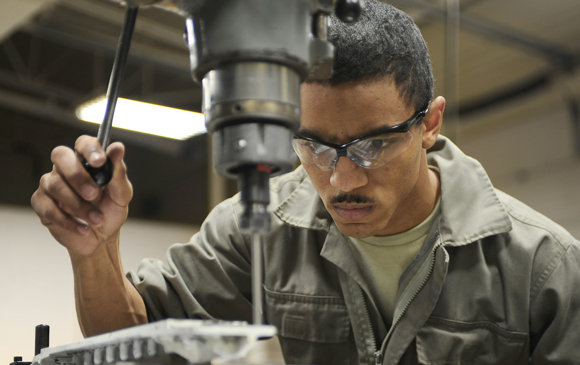 Worker performing industrial task safely